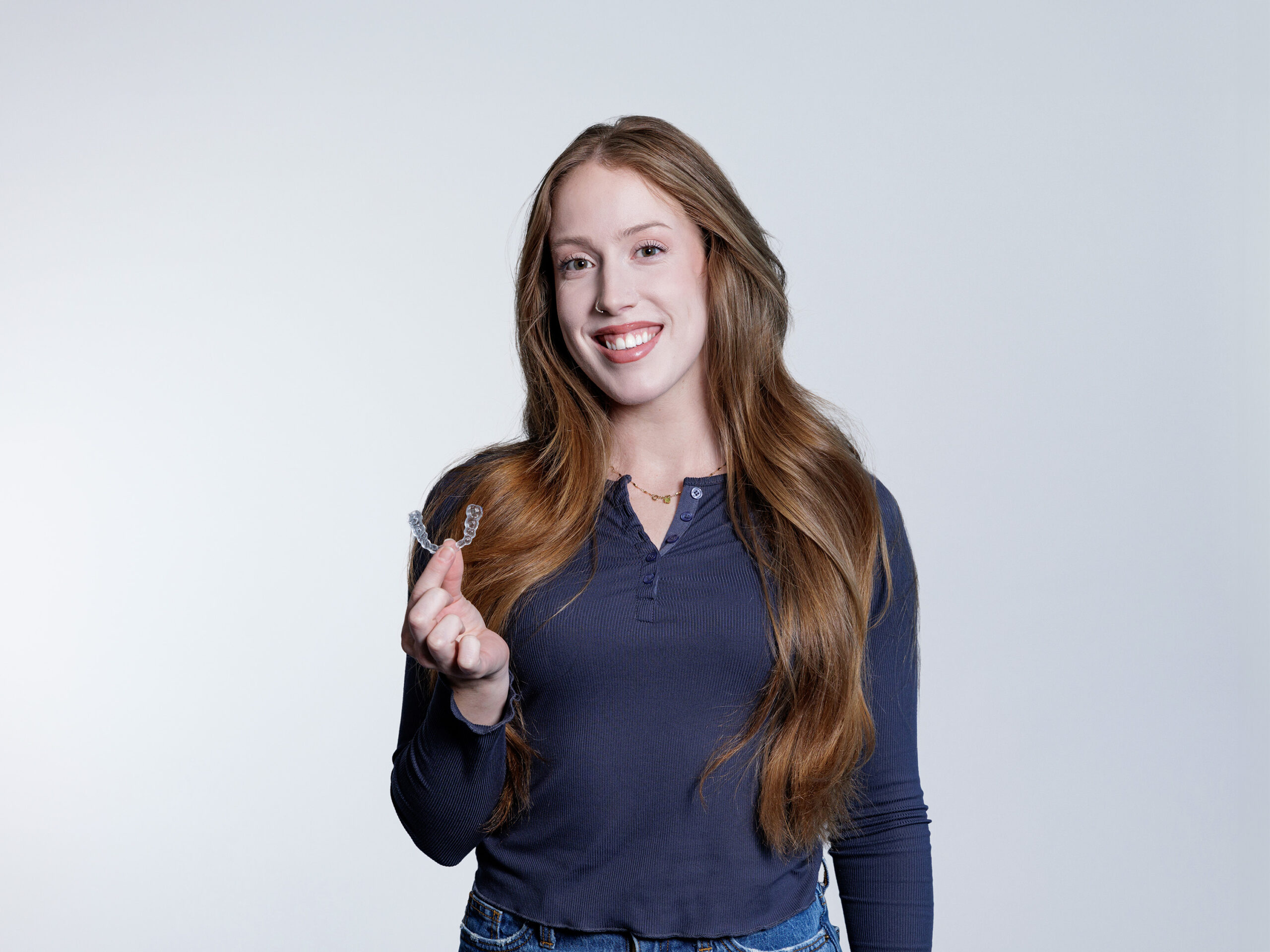 Woman holding a retainer